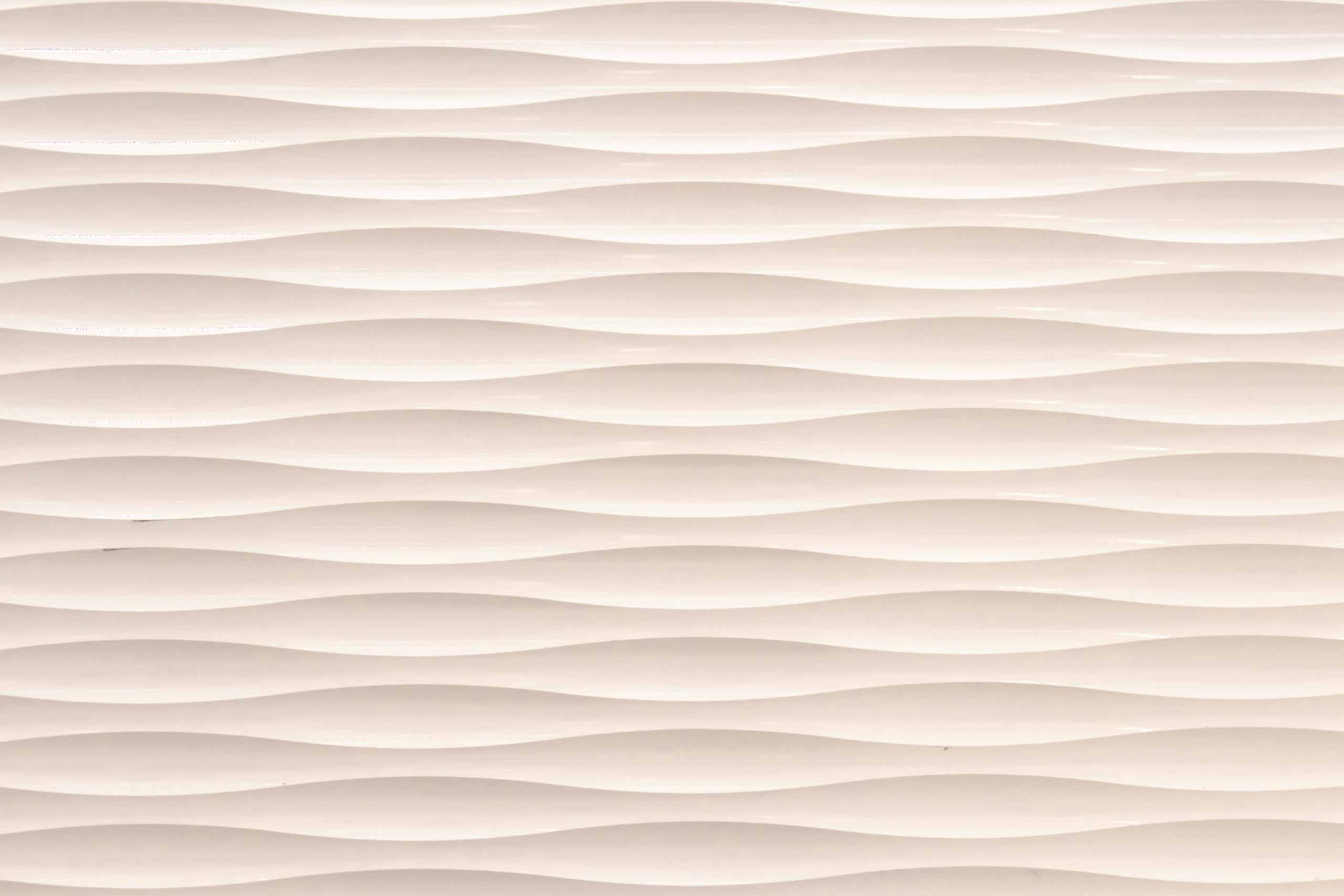 Seamless white wavy 3D texture, perfect for abstract and minimalist backgrounds.